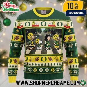Peanuts x Oregon Ducks Football Knitted Holiday Sweater 2025 Green And Yellow Christmas Ugly Sweater With Snoopy Charlie Brown And Winter Trees Pattern